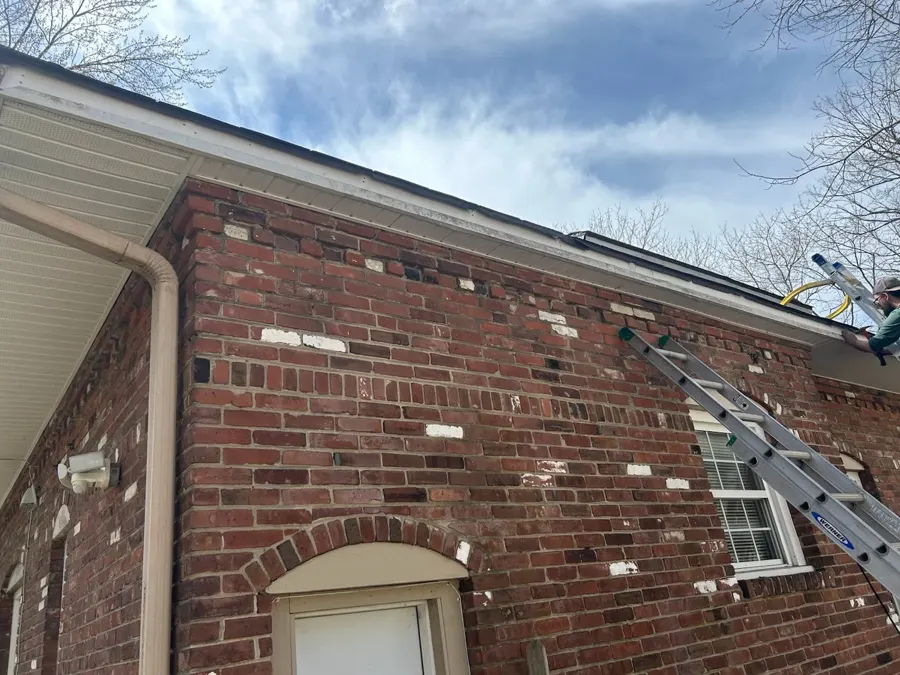 Rotten fascia board removed and replaced before gutter installation